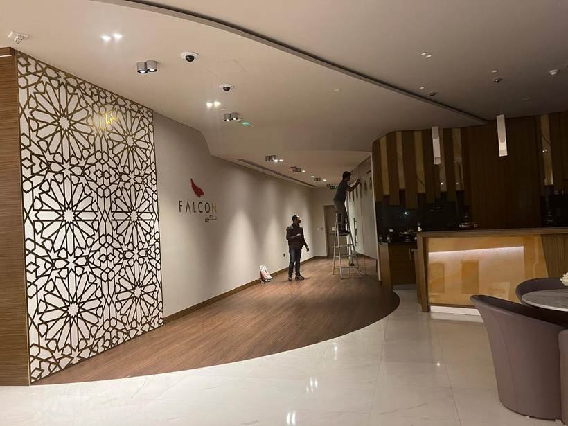 Falcon lobby wall with geometric feature panel and logo