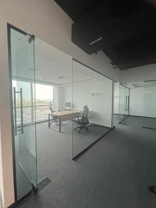 Power House glass office cabin with city view