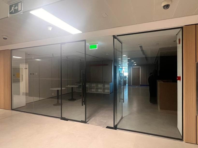 Power House glass partition corridor